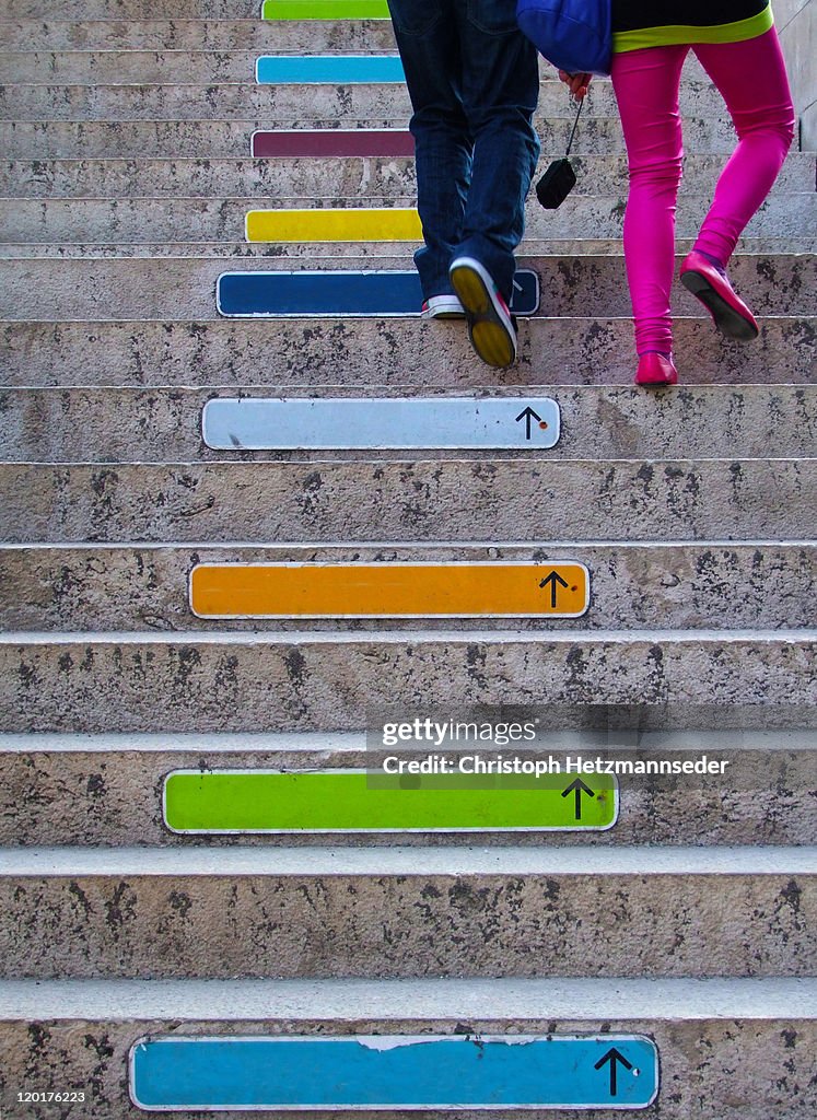 Colorful direction signs on stairs