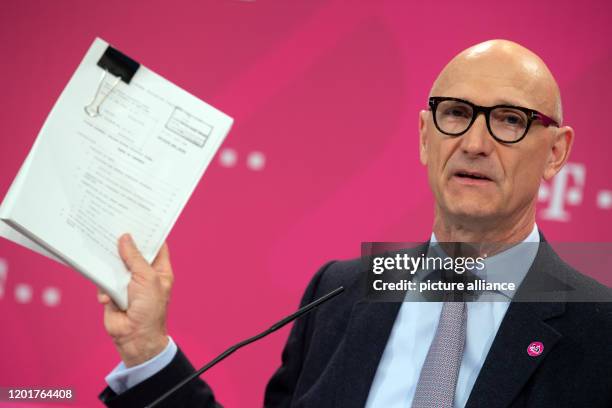 February 2020, North Rhine-Westphalia, Bonn: Tim Höttges, Chairman of the Board of Management of Deutsche Telekom, presents a ruling by a U.S. Court...