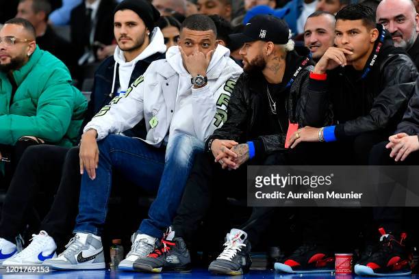 Kylian Mbappe, Neymar Jr and Thiago Silva of Paris Saint-Germain attend the NBA match between Milwaukee Bucks and Charlotte Hornets at AccorHotels...