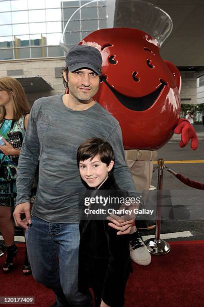 Director Robert Rodriguez and actor Mason Cook pose with Kool-Aid man at "Spy Kids: All The Time In The World 4D" Los Angeles premiere co-sponsored...