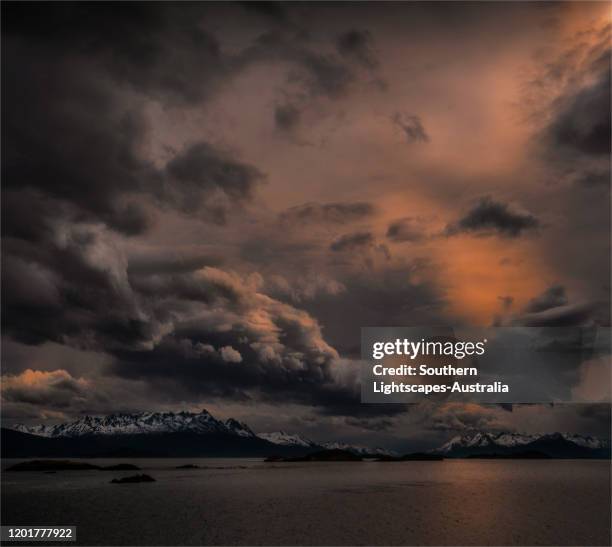 approaching storm and dramatic skies in the beagle channel, tierra del fuego, argentina. - cielo dramático fotografías e imágenes de stock