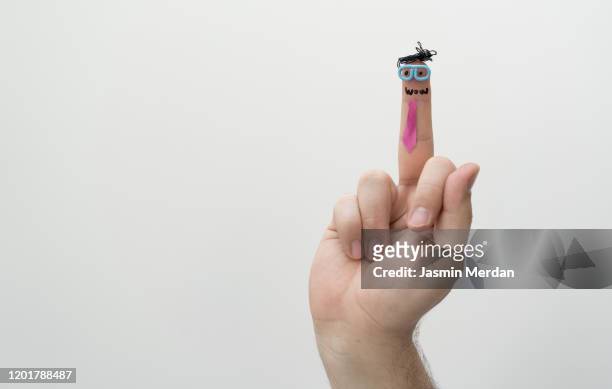middle finger man - kid middle finger imagens e fotografias de stock