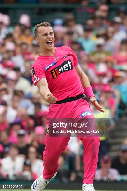 Tom Curran of the Sixers celebrates the wicket of during the Big Bash League match between the Sydney Sixers and the Melbourne Renegades at the...