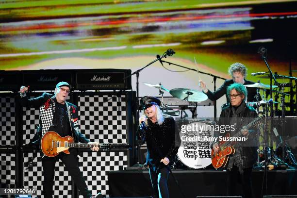 Rick Nielsen, Robin Zander, Tom Petersson, and Daxx Nielsen of Cheap Trick perform onstage during MusiCares Person of the Year honoring Aerosmith at...