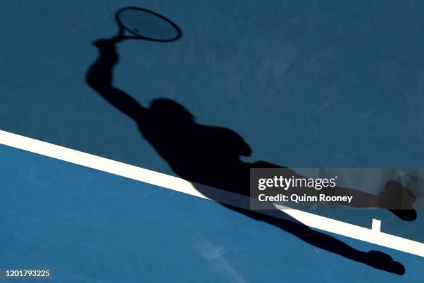 The shadow of Rafael Nadal of Spain as he plays a forehand during his Men's Singles third round match against Pablo Carreno Busta of Spain on day six...