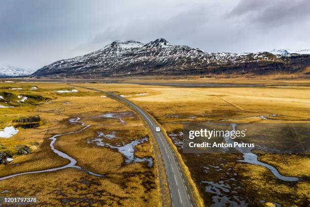 beautiful road on a volcanic landscape in iceland. - 4k解像度 ストックフォトと画像