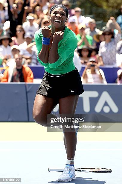 Serena Williams celebrates match point against Marion Bartoli of France during the final of the Bank of the West Classic at the Taube Family Tennis...