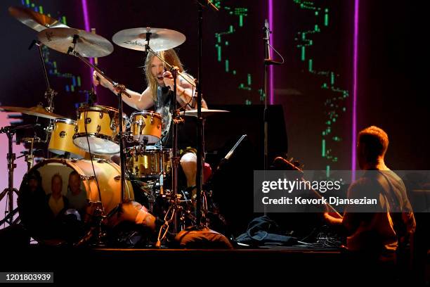 Taylor Hawkins and Nate Mendel of Foo Fighters perform onstage during MusiCares Person of the Year honoring Aerosmith at West Hall at Los Angeles...