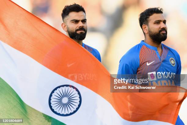 Captain Virat Kohli and vice-captain Rohit Sharma of India line up for their national anthem prior to game one of the Twenty20 series between New...