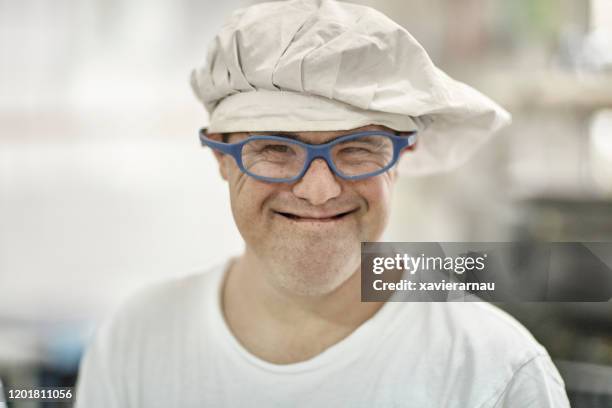 portrait of smiling hispanic male factory worker in mid 40s - hair net stock pictures, royalty-free photos & images