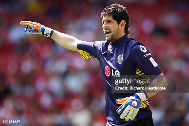 Agustin Orion of Boca Juniors directs his defence during the Emirates Cup match between Boca Juniors and Paris St Germain at the Emirates Stadium on...