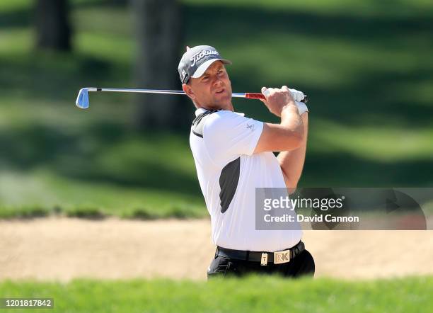 Robert Karlsson of Sweden plays his tsecond shot on the first hole during the third round of the Omega Dubai Desert Classic on the Majlis Course at...