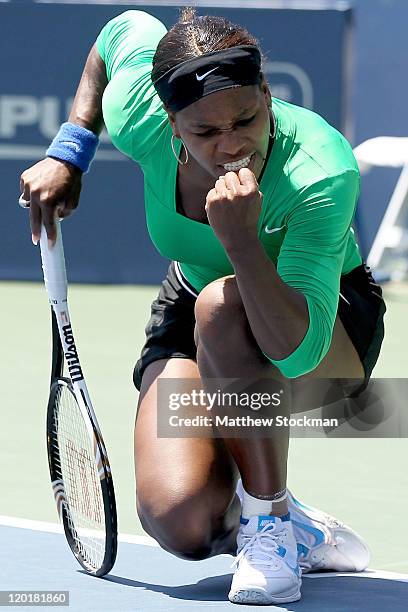 Serena Williams celebrates a point against Marion Bartoli of France during the final of the Bank of the West Classic at the Taube Family Tennis...