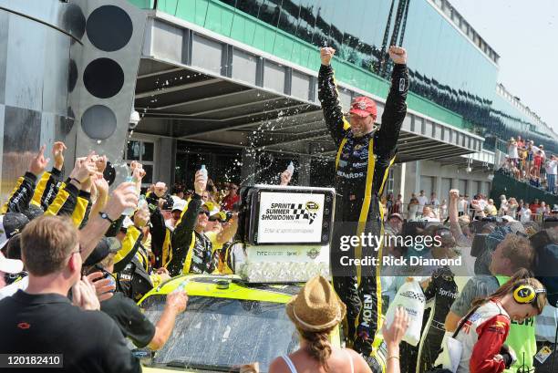 Brickyard 400 Winner Paul Menard celebrates at the Brickyard 400 presented by BigMachineRecords.com at Indianapolis Motorspeedway on July 31, 2011 in...