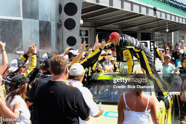 Brickyard 400 Winner Paul Menard celebrates at the Brickyard 400 presented by BigMachineRecords.com at Indianapolis Motorspeedway on July 31, 2011 in...