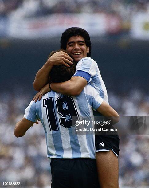 Diego Maradona of Argentina congratulates team mate Oscar Ruggeri after he scores the second goal against the Republic of Korea during the Group A...
