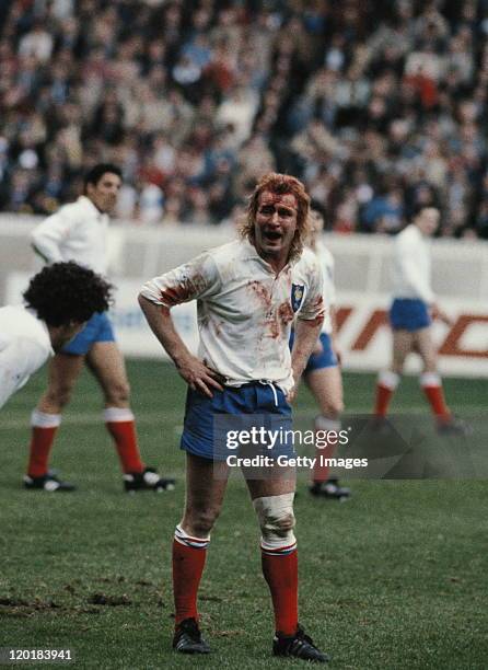 French captain Jean-Pierre Rives covered in blood after a collision with team-mate Serge Blanco during the Five Nations Championship game against...