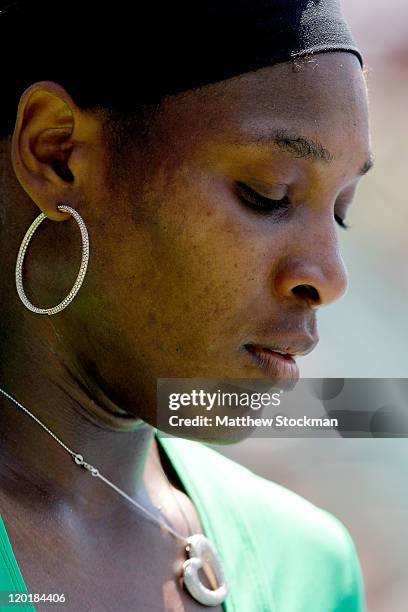 Serena Williams changes ends in the second set against Marion Bartoli of France during the final of the Bank of the West Classic at the Taube Family...