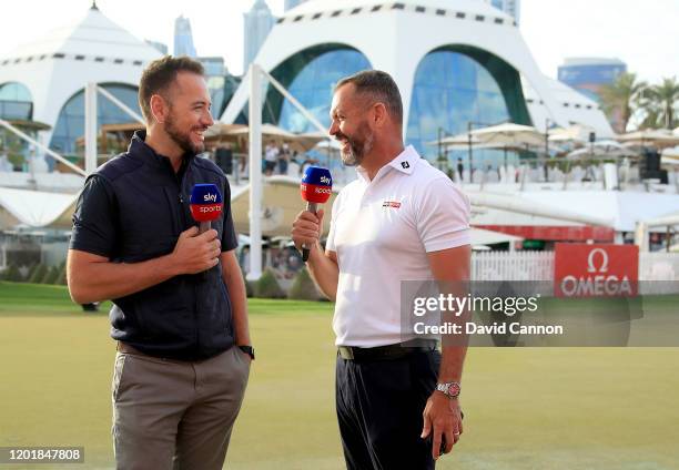 Nick Dougherty and Andrew Coltart talk to the Sky Television viewers after play during the third round of the Omega Dubai Desert Classic on the...