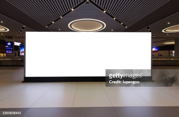 blank billboard at airport - billboard stock pictures, royalty-free photos & images