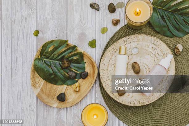 organic spa cosmetic on wooden background - argan stock-fotos und bilder