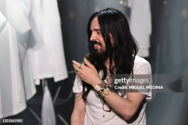 Italian fashion designer Alessandro Michele acknowledges applause following the presentation of Gucci's Women Fall - Winter 2020 collection on...