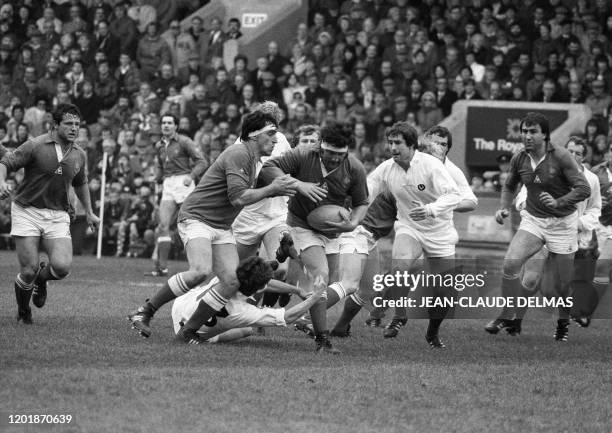 French rugby player Pierre Dospital escapes with the ball helped by teammate Jean-Charles Orso during the Five Nations Tournament game between France...