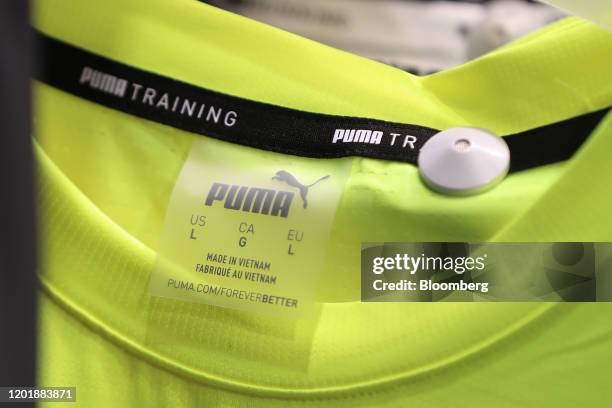 The words 'Made in Vietnam' sits on a Puma Training shirt label inside the Puma SE concept store in Herzogenaurach, Germany, on Wednesday, Feb. 19,...