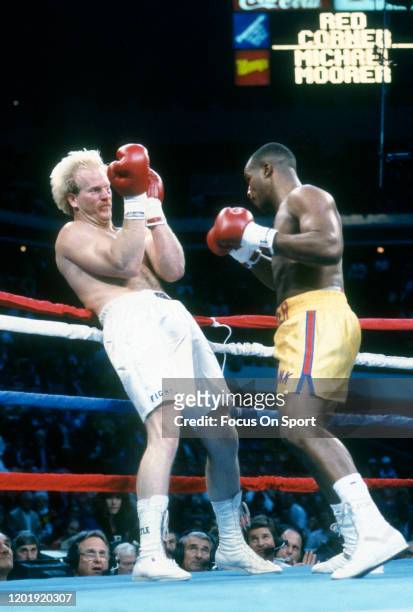 Bobby Crabtree and Michael Moorer fight during a heavyweight match on November 23, 1991 at the Omni Coliseum in Atlanta, Georgia. Moorer won the...