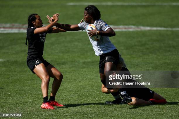 Raijieli Daveua of Fiji is tackled by Kelly Brazier and Tyla Nathan-Wong of New Zealand during the match between New Zealand and Fiji at the 2020...