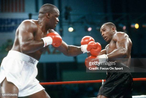 Buster Douglas and Mike Williams fight during heavyweight match on June 27, 1988 at the Convention Hall in Atlantic City, New Jersey. Douglas won the...