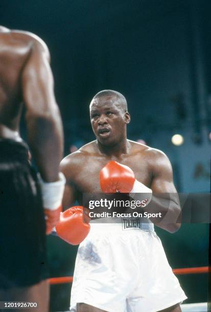 Buster Douglas and Mike Williams fight during heavyweight match on June 27, 1988 at the Convention Hall in Atlantic City, New Jersey. Douglas won the...