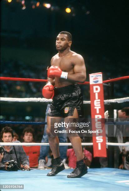 Mike Tyson looks on from his corner prior to the start of the WBC, WBA and Ring Heavyweight title fight against Michael Spinks on June 27, 1988 at...