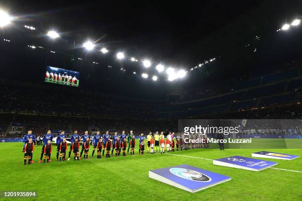 Atalanta and Valencia CF teams line up before the UEFA Champions League round of 16 first leg match between Atalanta and Valencia CF at San Siro...