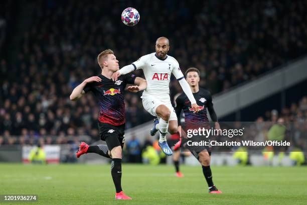 Lucas Moura of Spurs battles with Marcel Halstenberg of RB Leipzig and Ethan Ampadu of RB Leipzig during the UEFA Champions League round of 16 first...