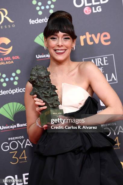 Belen Cuesta holds the Best Actress Award for the film "La Trinchera Infinita" during the 34rd edition of the Goya Cinema Awards at Jose Maria Martin...