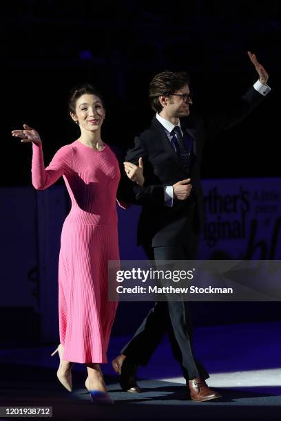 Meryl Davis and Charlie White wave to the crowd as they are introduced at their Hall of Fame Induction Ceremony during the 2020 U.S. Figure Skating...