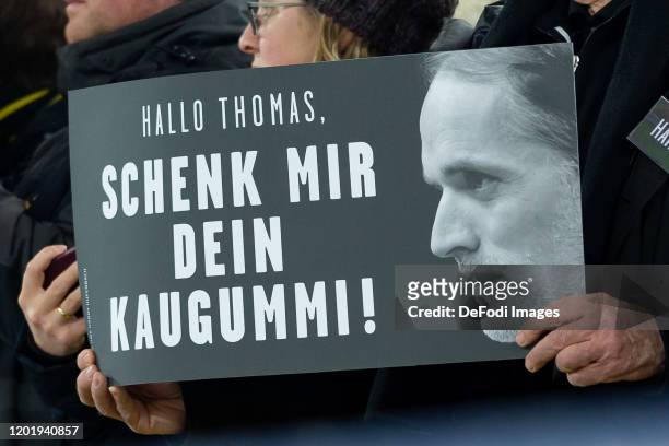 Poster "Hallo Thomas, schenk mir dein Kaugummi!" are seen during the UEFA Champions League round of 16 first leg match between Borussia Dortmund and...