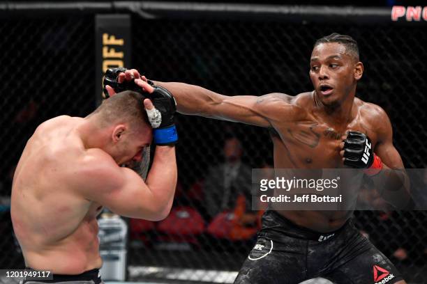 Jamahal Hill punches Darko Stosic of Serbia in their light heavyweight bout during the UFC Fight Night event at PNC Arena on January 25, 2020 in...