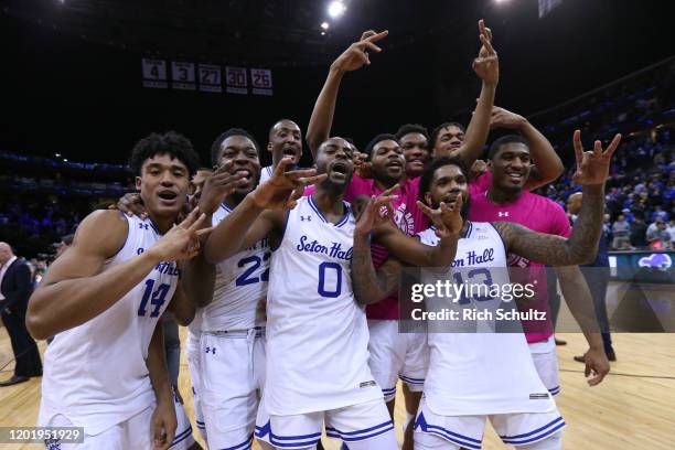 Jared Rhoden, Myles Cale, Quincy McKnight Myles Powell and the rest of the Seton Hall Pirates celebrate after Sandro Mamukelashvili scored the game...