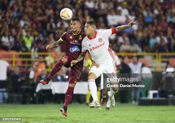 Yeison Gordillo of Tolima fights for the ball against Paolo Guerrero of Internacional during the third round first leg match between Deportes Tolima...