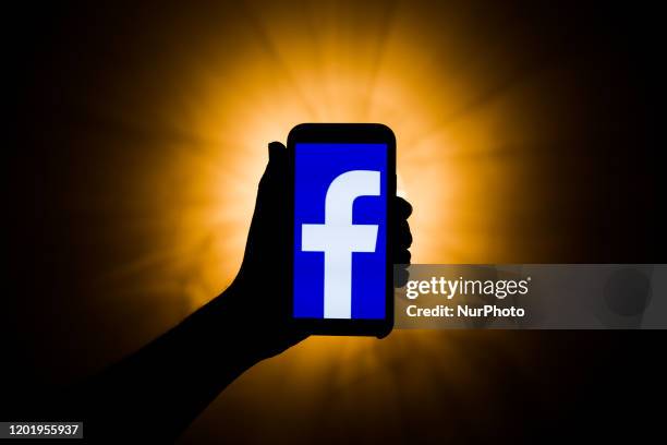 In this photo illustration the Facebook logo is seen displayed on smartphone screen in this illustration photo taken in Poland on February 19, 2020.