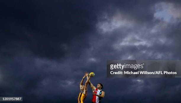Tom Scully of the Hawks and Hunter Clark of the Saints compete for the ball during the 2020 Marsh Community Series match between the St Kilda Saints...