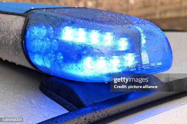 February 2020, Schleswig-Holstein, Kiel: A patrol car of the police is parked in Kiel with the blue light switched on. Photo: Carsten Rehder/dpa