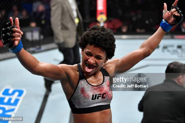 Angela Hill celebrates her TKO victory over Hannah Cifers in their women's strawweight bout during the UFC Fight Night event at PNC Arena on January...