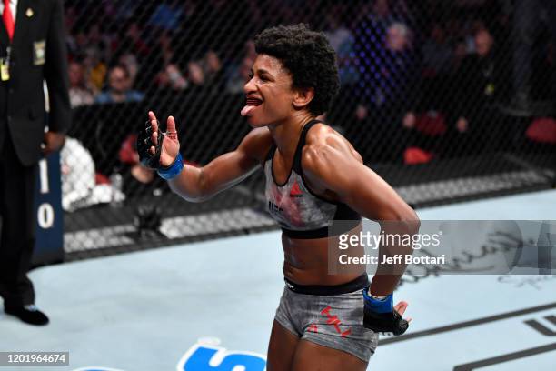 Angela Hill celebrates her TKO victory over Hannah Cifers in their women's strawweight bout during the UFC Fight Night event at PNC Arena on January...
