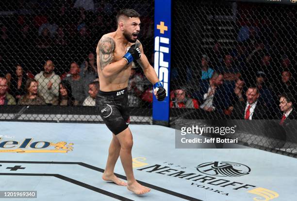 Alex Perez celebrates after his submission victory over Jordan Espinosa in their flyweight fight during the UFC Fight Night event at PNC Arena on...
