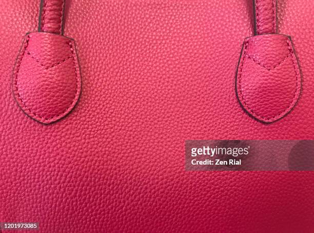 red handbag showing part of handle stitched on side - sac en cuir photos et images de collection