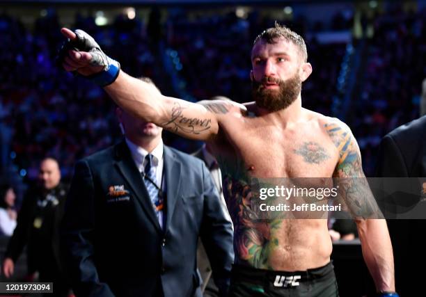Michael Chiesa celebrates after his decision victory over Rafael Dos Anjos of Brazil in their welterweight fight during the UFC Fight Night event at...
