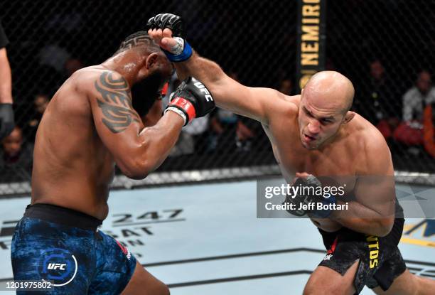 Junior Dos Santos of Brazil punches Curtis Blaydes in their heavyweight fight during the UFC Fight Night event at PNC Arena on January 25, 2020 in...
